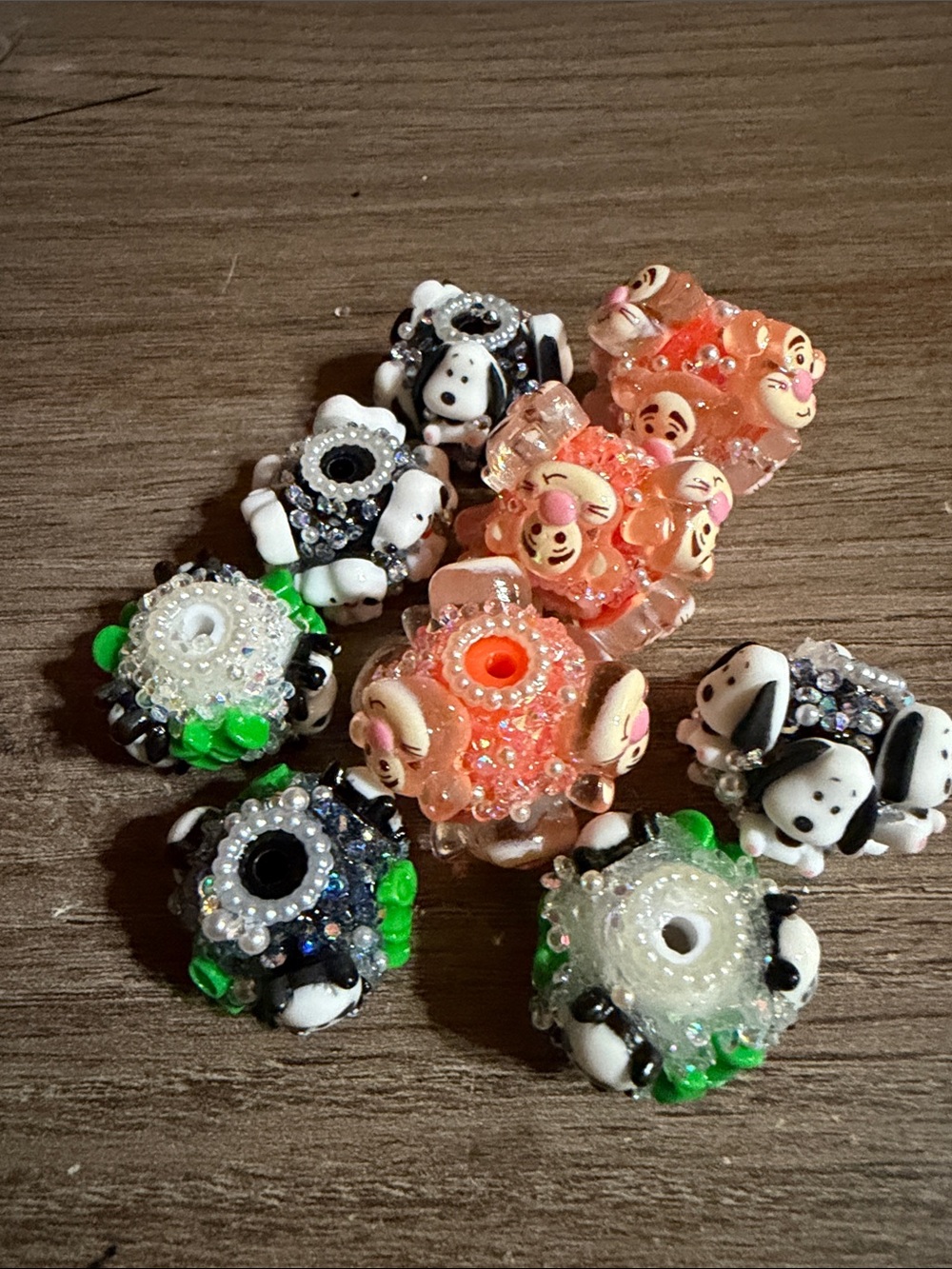 Lot of 9 fancy beads. 3 Snoopy, 3 Tigger and 3 panda